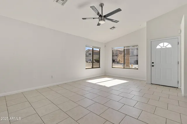 a view of an empty room with a window