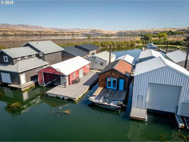an aerial view of a house with a ocean view