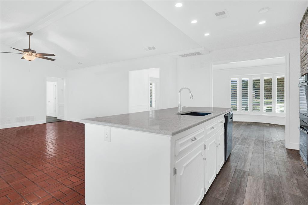 1104 West Lookout Drive Richardson, TX 75080 - Photo 14 of 40 a kitchen with sink and cabinets