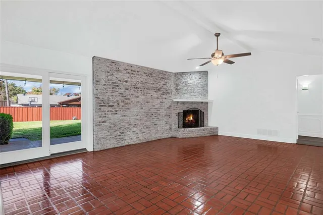 a view of a kitchen with a fireplace a sink and a fireplace