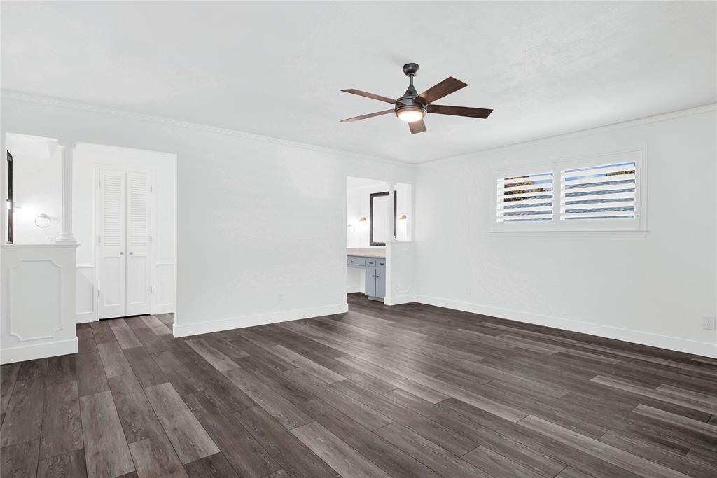 1104 West Lookout Drive Richardson, TX 75080 - Photo 19 of 40 a view of empty room with wooden floor and fan