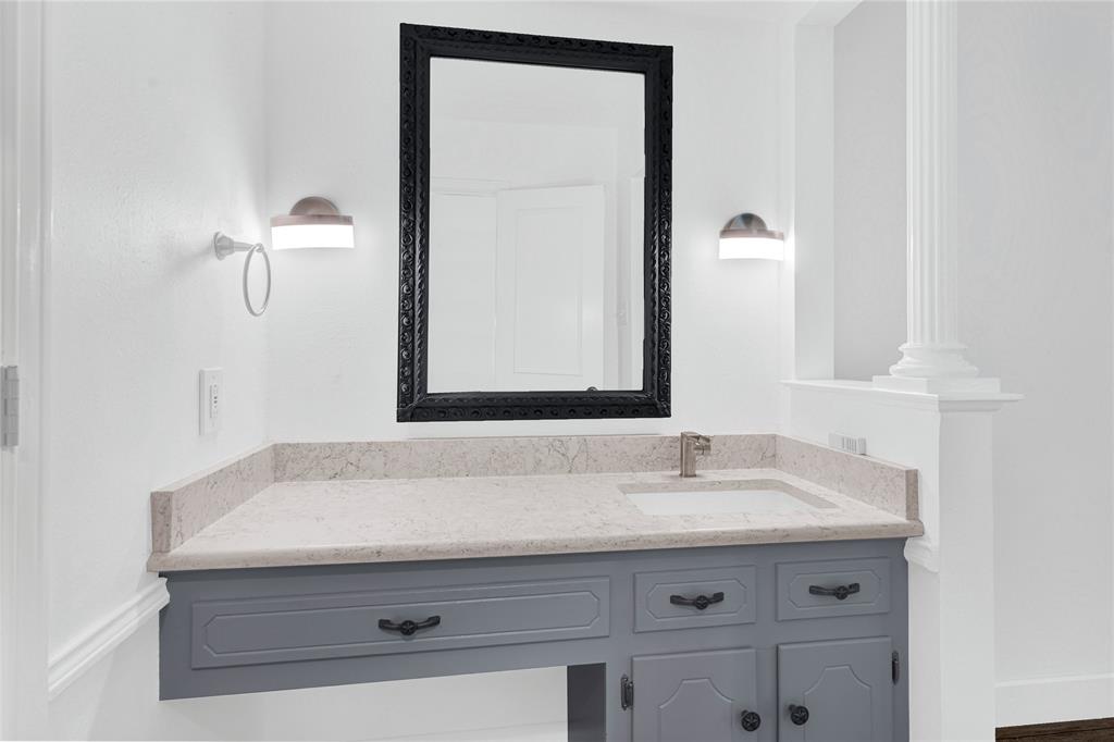 1104 West Lookout Drive Richardson, TX 75080 - Photo 21 of 40 a bathroom with a sink and a mirror