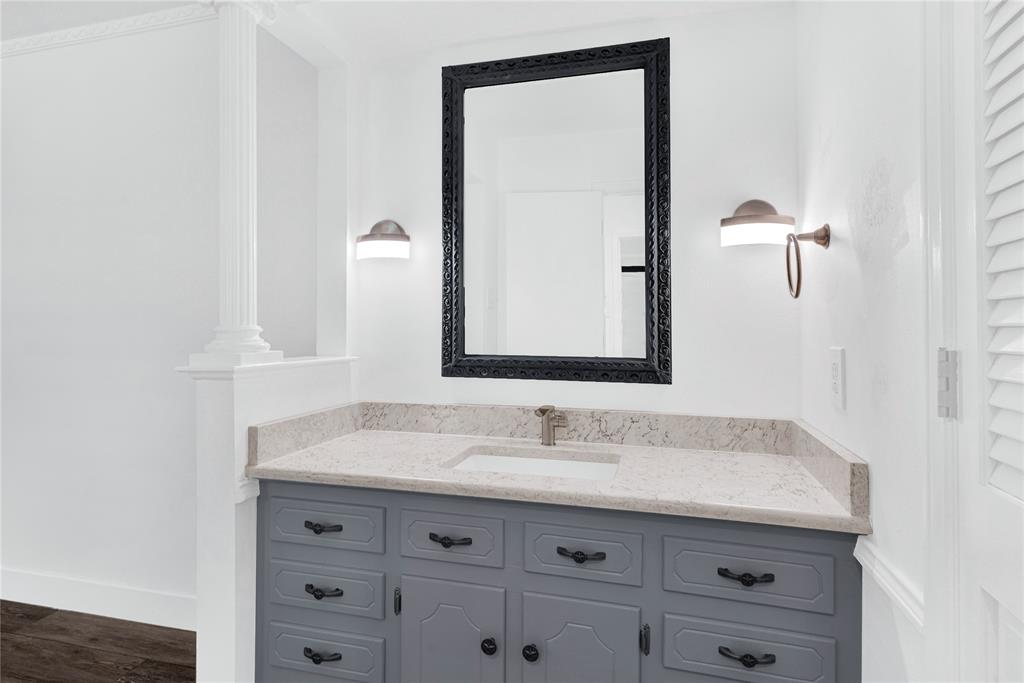 1104 West Lookout Drive Richardson, TX 75080 - Photo 22 of 40 a bathroom with a sink and a mirror