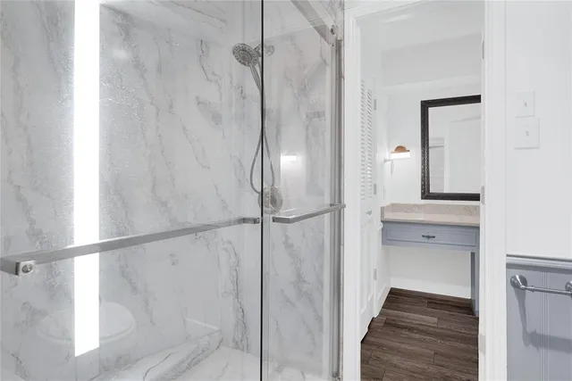 a bathroom with a sink toilet and shower