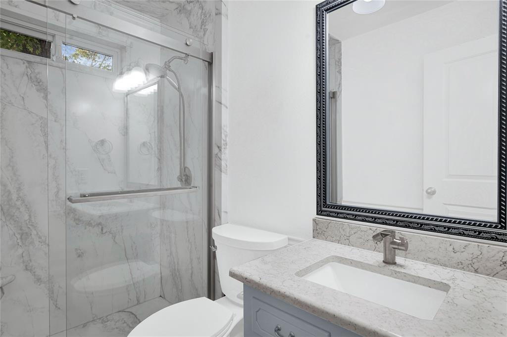1104 West Lookout Drive Richardson, TX 75080 - Photo 24 of 40 a bathroom with a sink toilet and shower