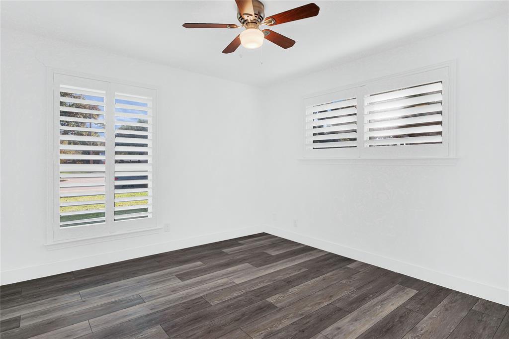 1104 West Lookout Drive Richardson, TX 75080 - Photo 25 of 40 a view of empty room with wooden floor and fan
