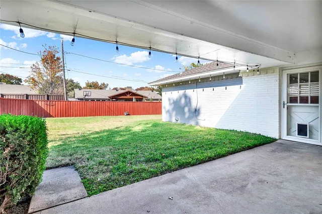 a view of yard with swimming pool and green space