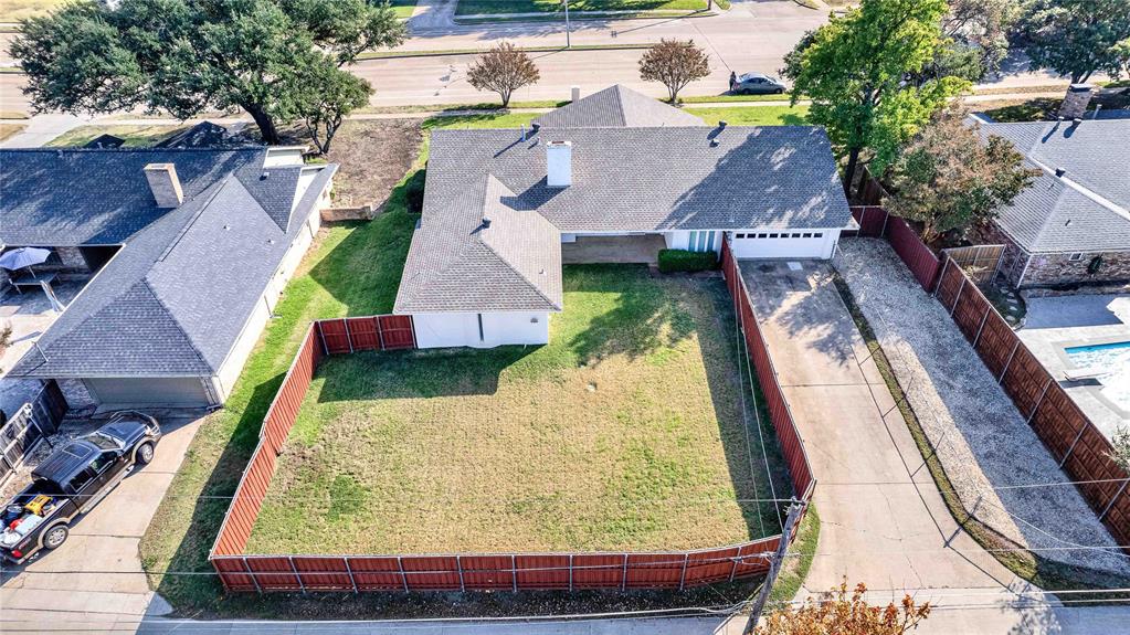 1104 West Lookout Drive Richardson, TX 75080 - Photo 4 of 40 an aerial view of a house with swimming pool
