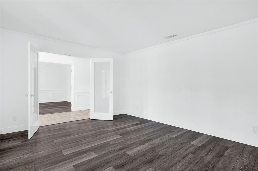 1104 West Lookout Drive Richardson, TX 75080 - Photo 8 of 40 a view of an empty room with wooden floor