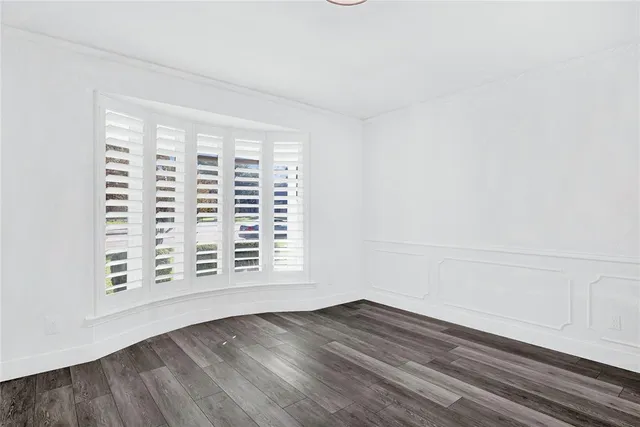 a view of kitchen and wooden floor