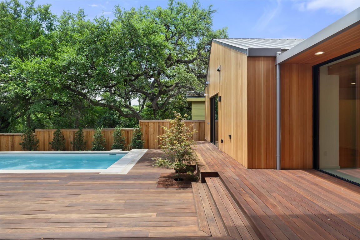 1319 Bonham Terrace Austin, TX 78704 - Photo 23 of 24 View of swimming pool featuring a wooden deck and a fenced backyard