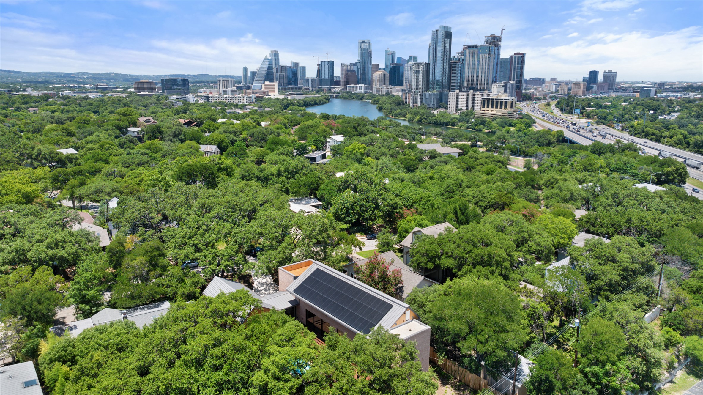 1319 Bonham Terrace Austin, TX 78704 - Photo 4 of 24 Aerial view of a large body of water and city skyline