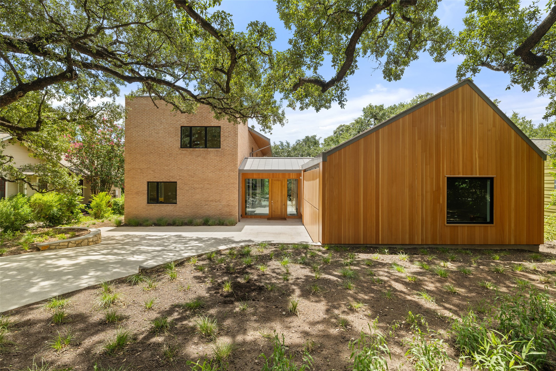 1319 Bonham Terrace Austin, TX 78704 - Photo 5 of 24 Rear view of property with concrete driveway