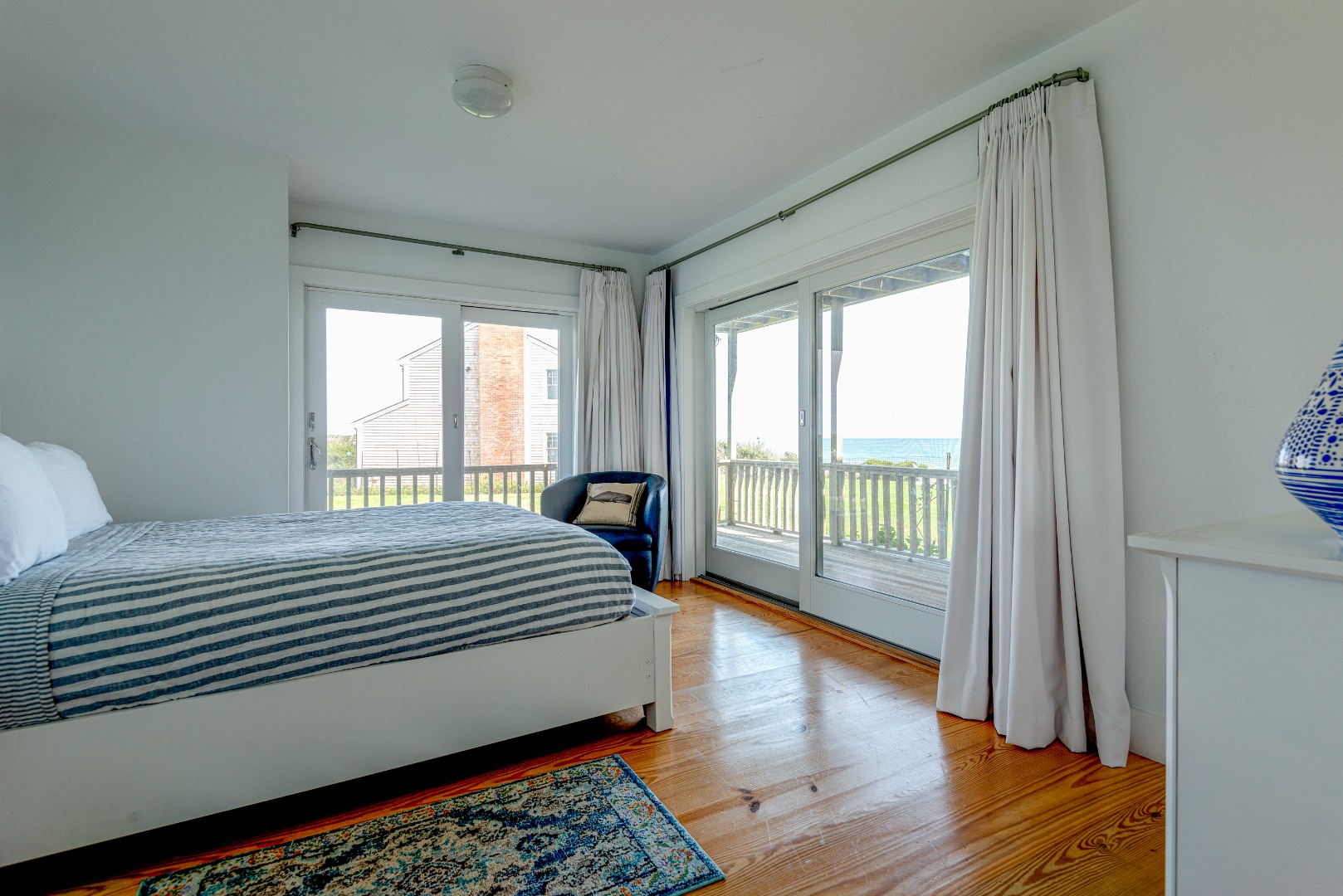 1 Reeds Way Nantucket, MA 02554 - Photo 50 of 51 a bedroom with a large bed and wooden floor