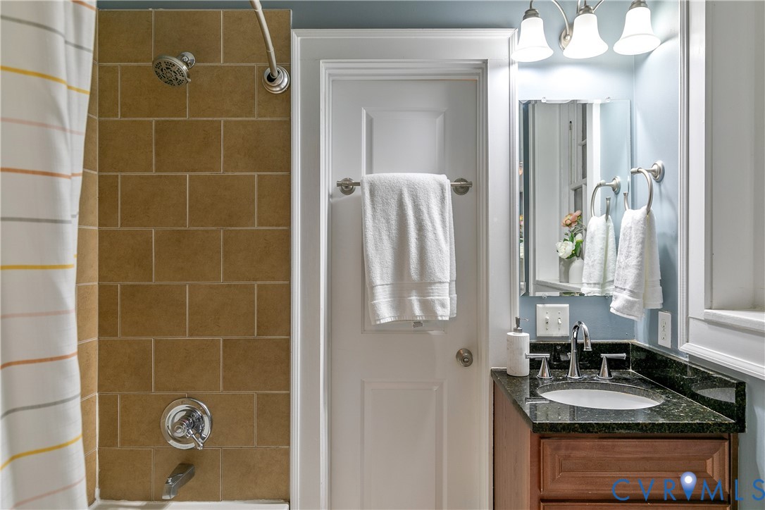 601 Roseneath Road, Unit U1 Richmond, VA 23221 - Photo 25 of 36 Bathroom featuring a wood vanity with a granite co