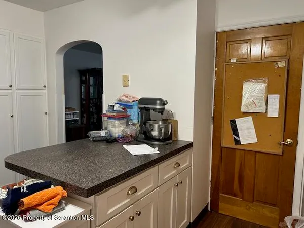 a kitchen with a sink and cabinets