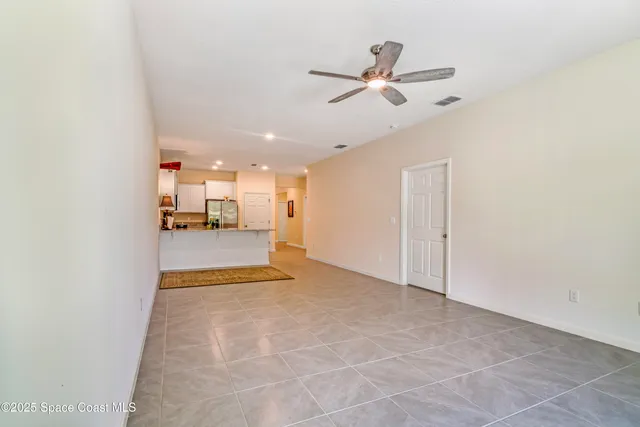 a view of livingroom and kitchen with sink