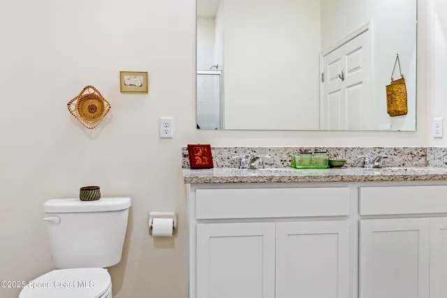 a bathroom with a toilet and a sink