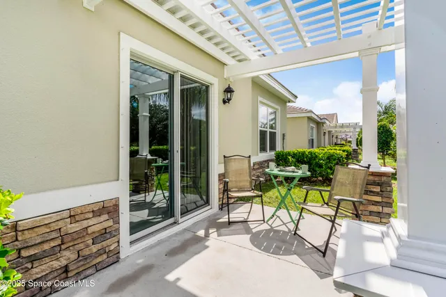 a view of yard with patio