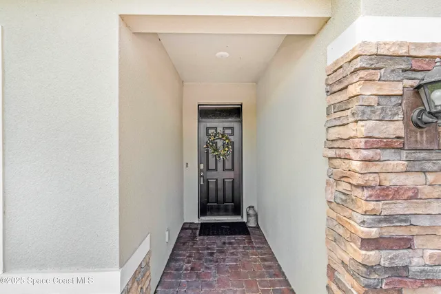 a view of a hallway with entryway