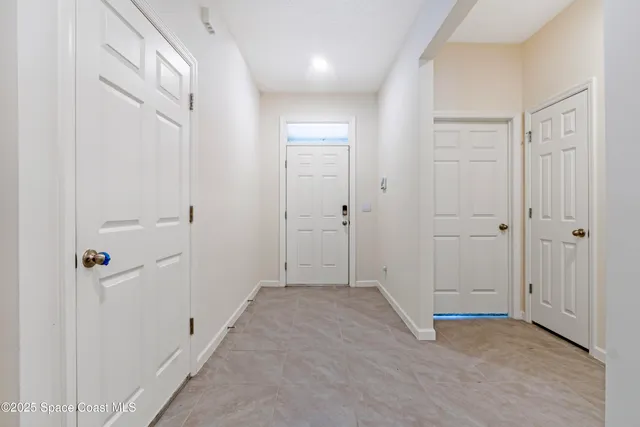 a view of a hallway with closet area