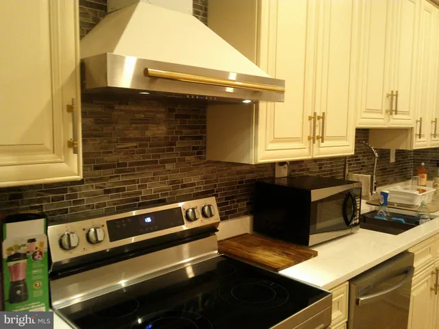 a kitchen with a stove and a microwave