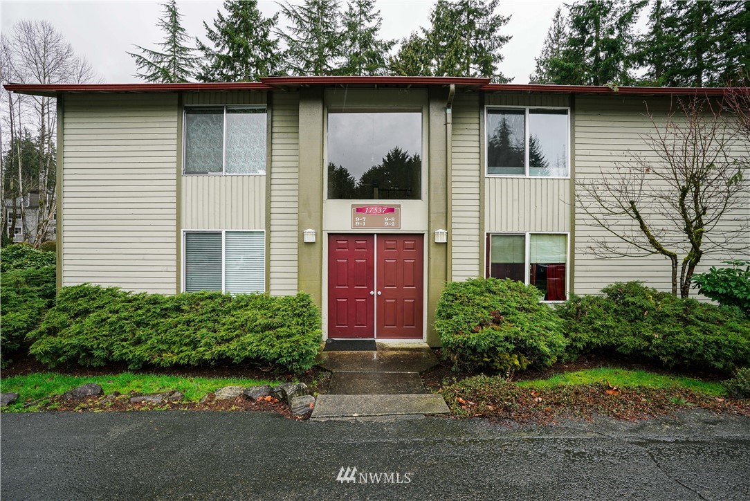 17537 151st Avenue Southeast, Unit 98 Renton, WA 98058 - Photo 1 of 19 a front view of a house with garden
