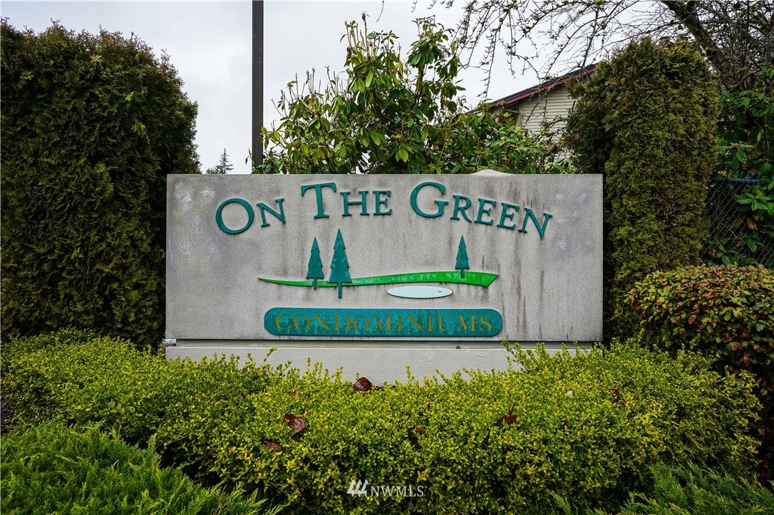 17537 151st Avenue Southeast, Unit 98 Renton, WA 98058 - Photo 2 of 19 a sign that is on the side of a road