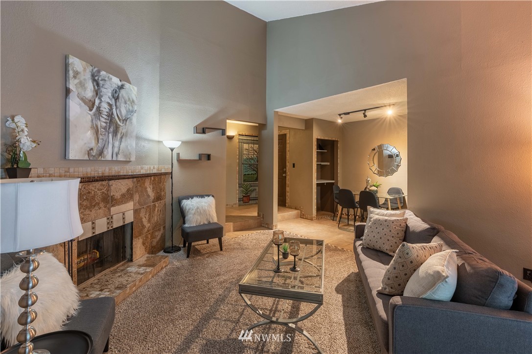 17537 151st Avenue Southeast, Unit 98 Renton, WA 98058 - Photo 5 of 19 a living room with furniture and a fireplace