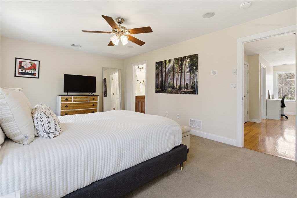 94 Progress Street, Unit 94 Abington, MA 02351 - Photo 16 of 35 a bedroom with a bed and a flat screen tv