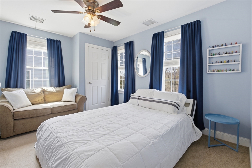 94 Progress Street, Unit 94 Abington, MA 02351 - Photo 18 of 35 a bedroom with a bed couch and window