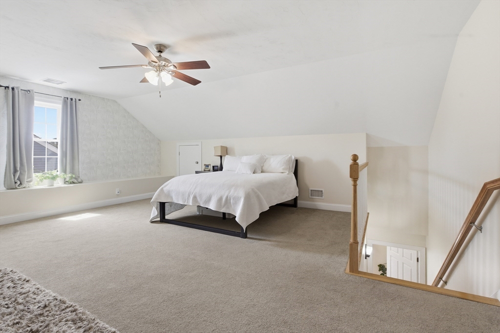 94 Progress Street, Unit 94 Abington, MA 02351 - Photo 23 of 35 a spacious bedroom with a bed and a window