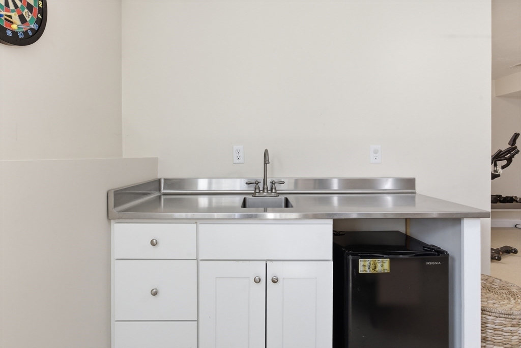 94 Progress Street, Unit 94 Abington, MA 02351 - Photo 31 of 35 a kitchen with a sink and cabinets