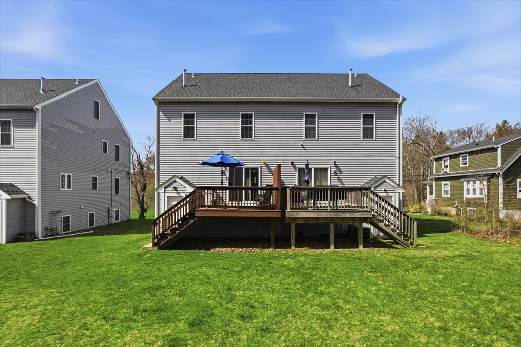 94 Progress Street, Unit 94 Abington, MA 02351 - Photo 34 of 35 a front view of house with yard and seating area