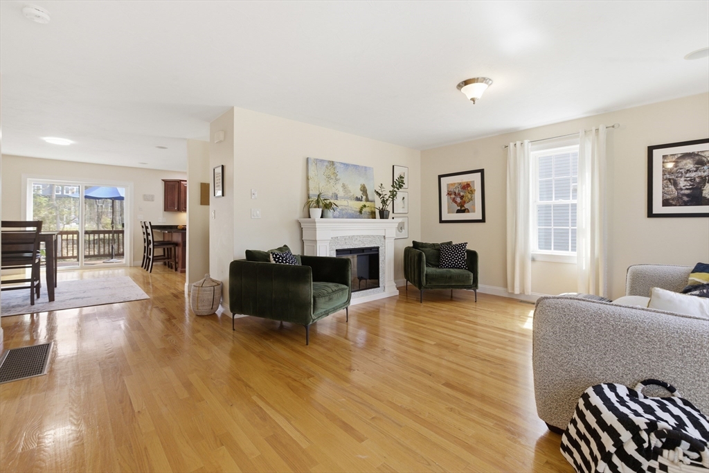 94 Progress Street, Unit 94 Abington, MA 02351 - Photo 4 of 35 a living room with furniture and a flat screen tv
