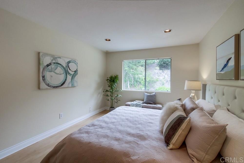 12909 Caminito Bodega Del Mar, CA 92014 - Photo 27 of 50 a bedroom with a large bed and a window