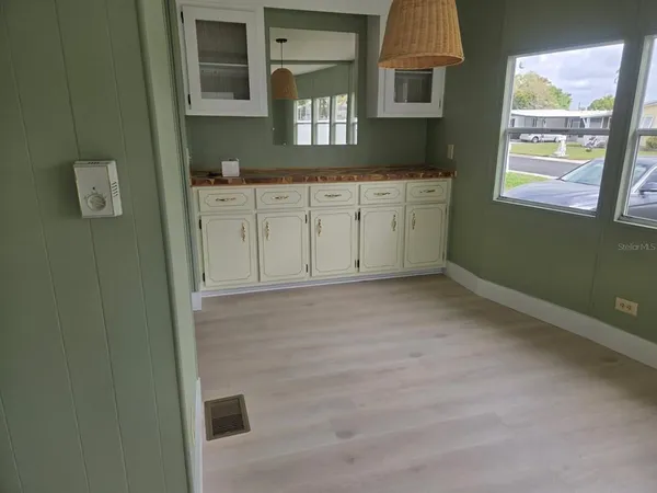 a view of a kitchen with cabinets