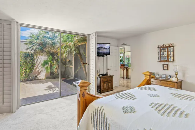 a bathroom with a double vanity sink mirror and bathtub
