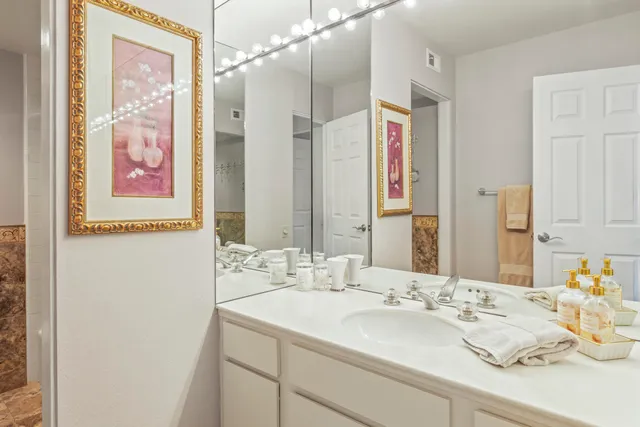 a utility room with cabinets washer and dryer