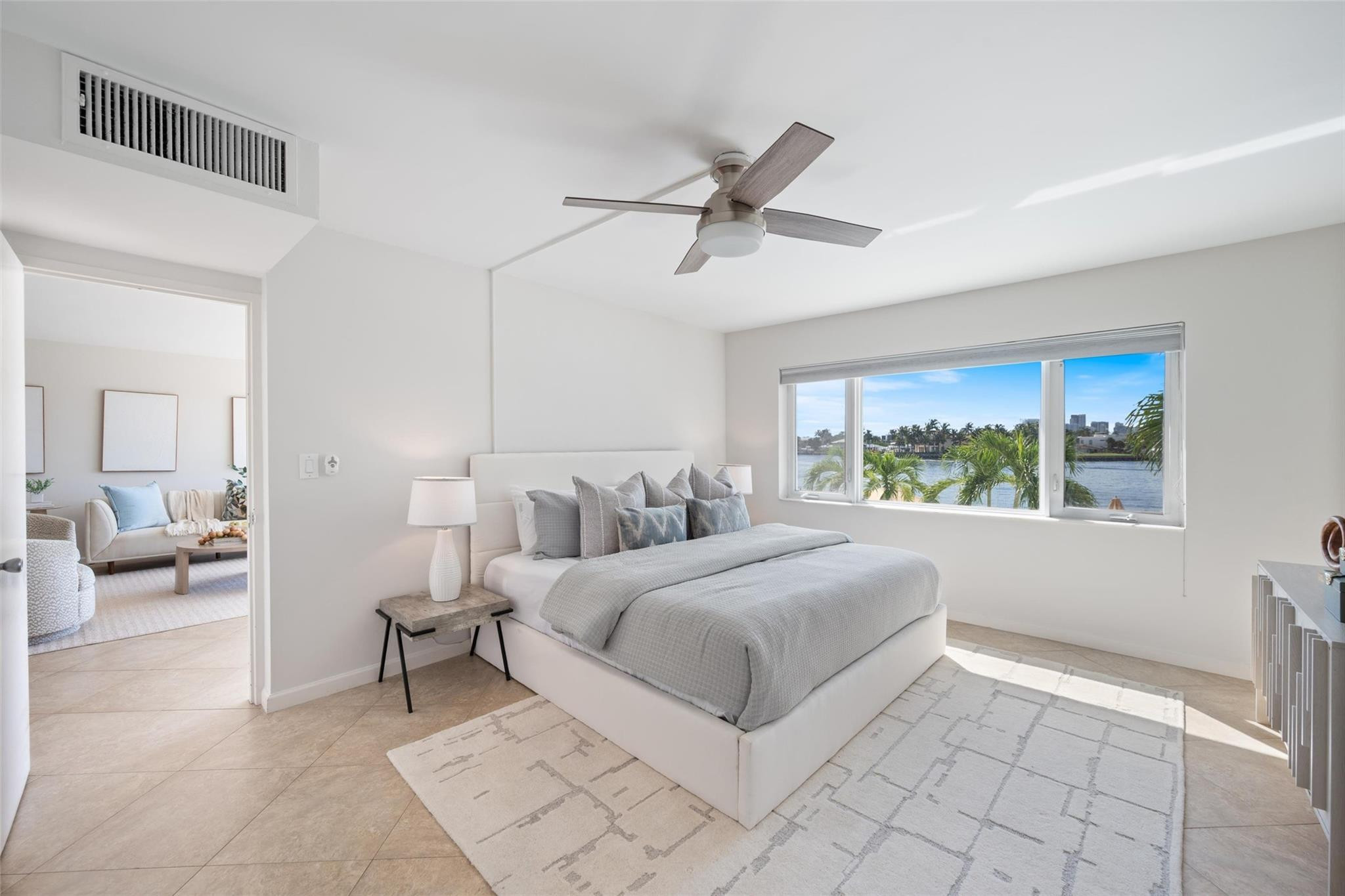 215 North Birch Road, Unit 2B Fort Lauderdale, FL 33304 - Photo 16 of 34 a spacious bedroom with a bed and a large window