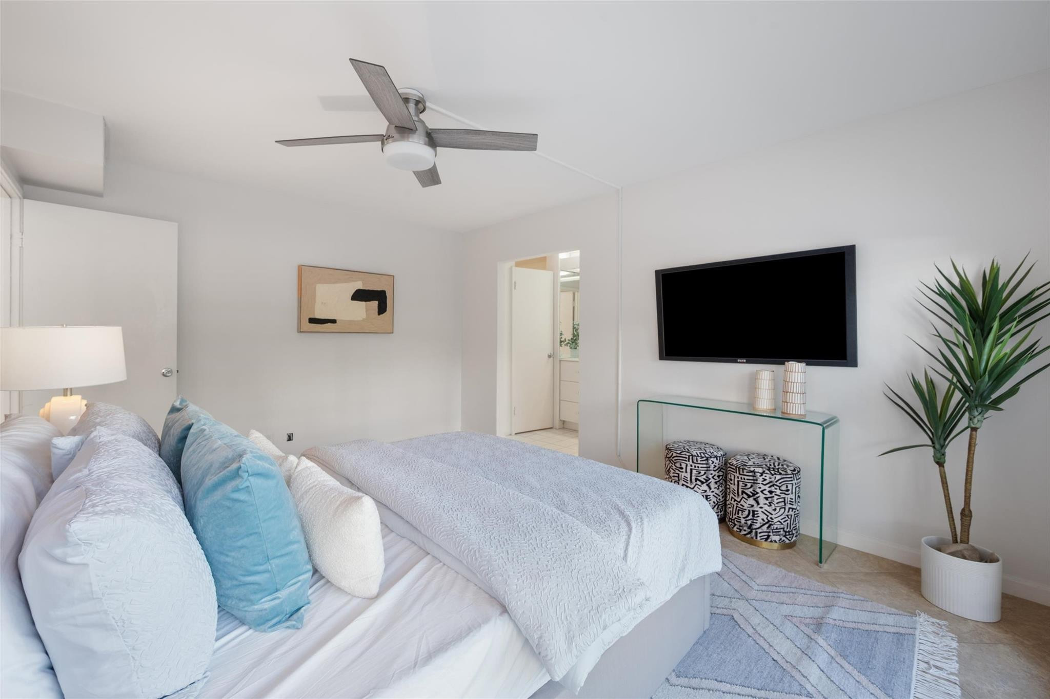 215 North Birch Road, Unit 2B Fort Lauderdale, FL 33304 - Photo 19 of 34 a bedroom with a bed and a television