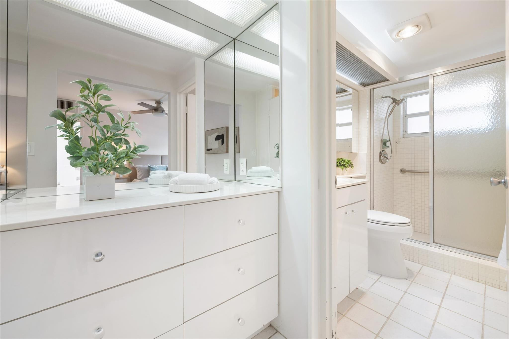 215 North Birch Road, Unit 2B Fort Lauderdale, FL 33304 - Photo 22 of 34 a bathroom with a sink and a mirror