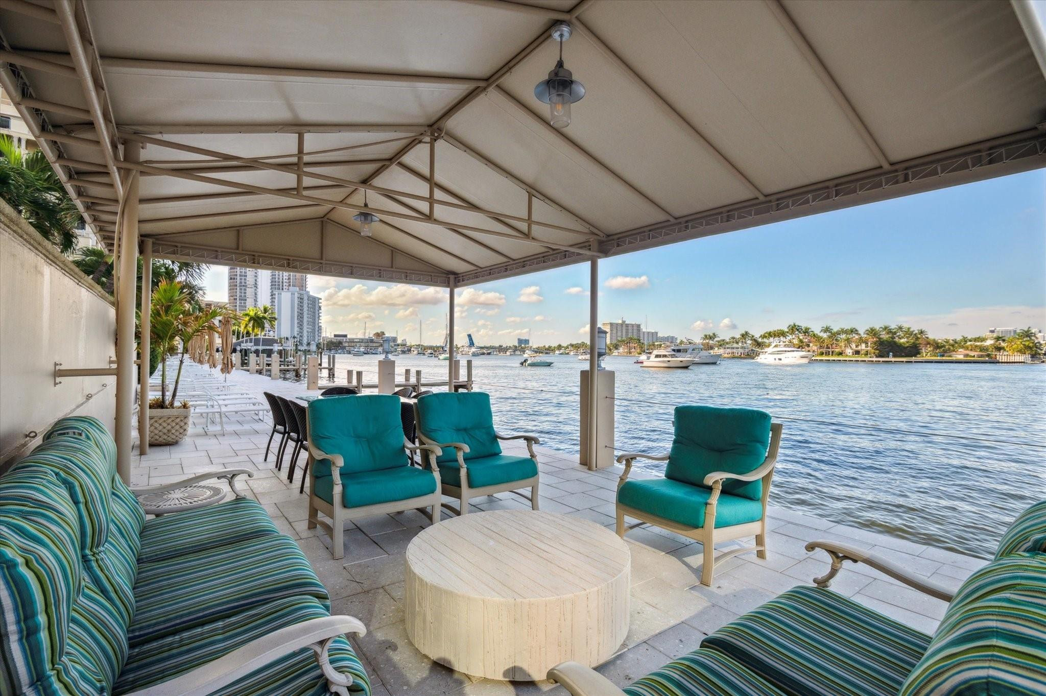 215 North Birch Road, Unit 2B Fort Lauderdale, FL 33304 - Photo 29 of 34 a building outdoor space with patio furniture and potted plants