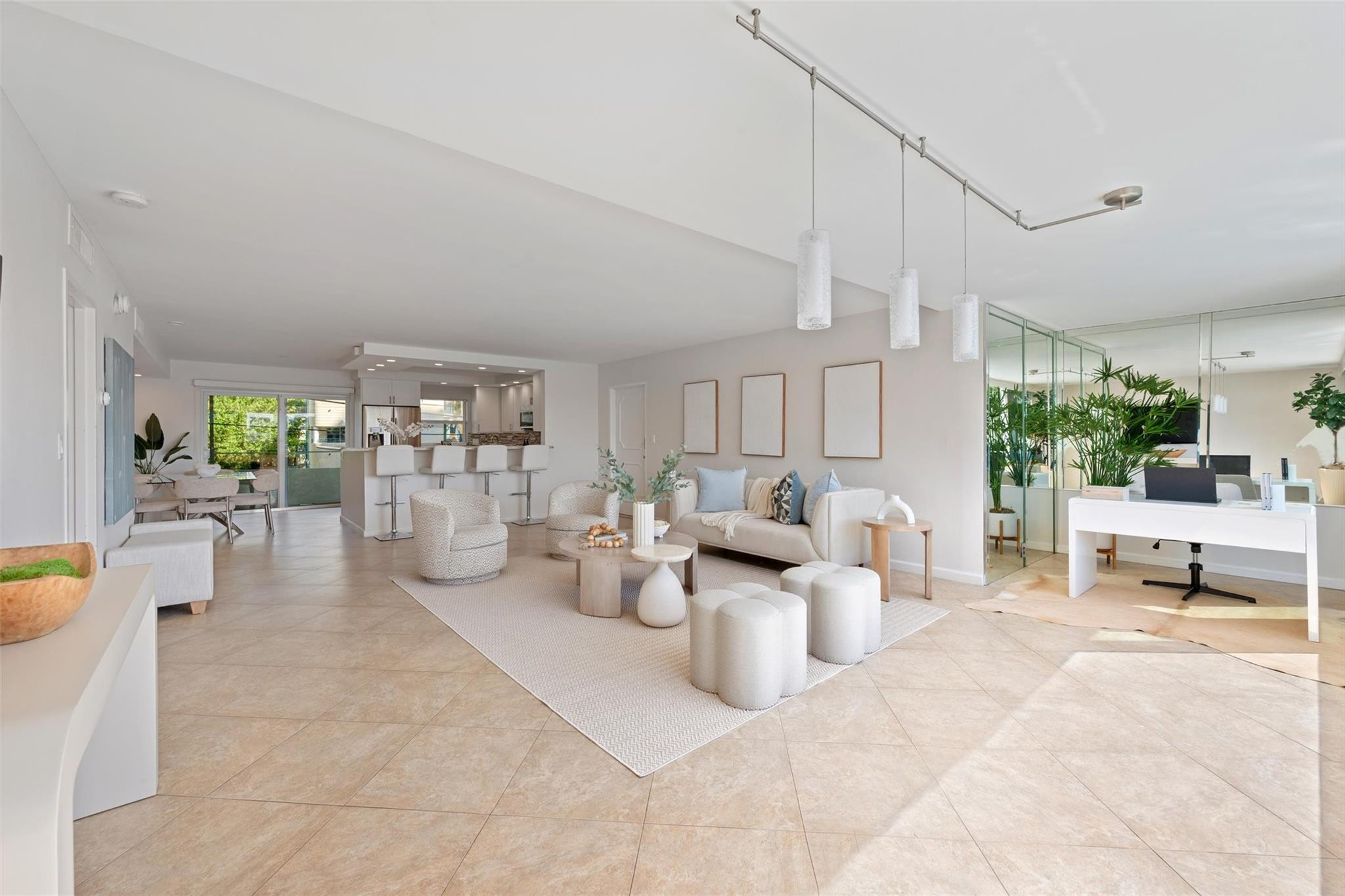 215 North Birch Road, Unit 2B Fort Lauderdale, FL 33304 - Photo 5 of 34 a living room with patio furniture and a large window