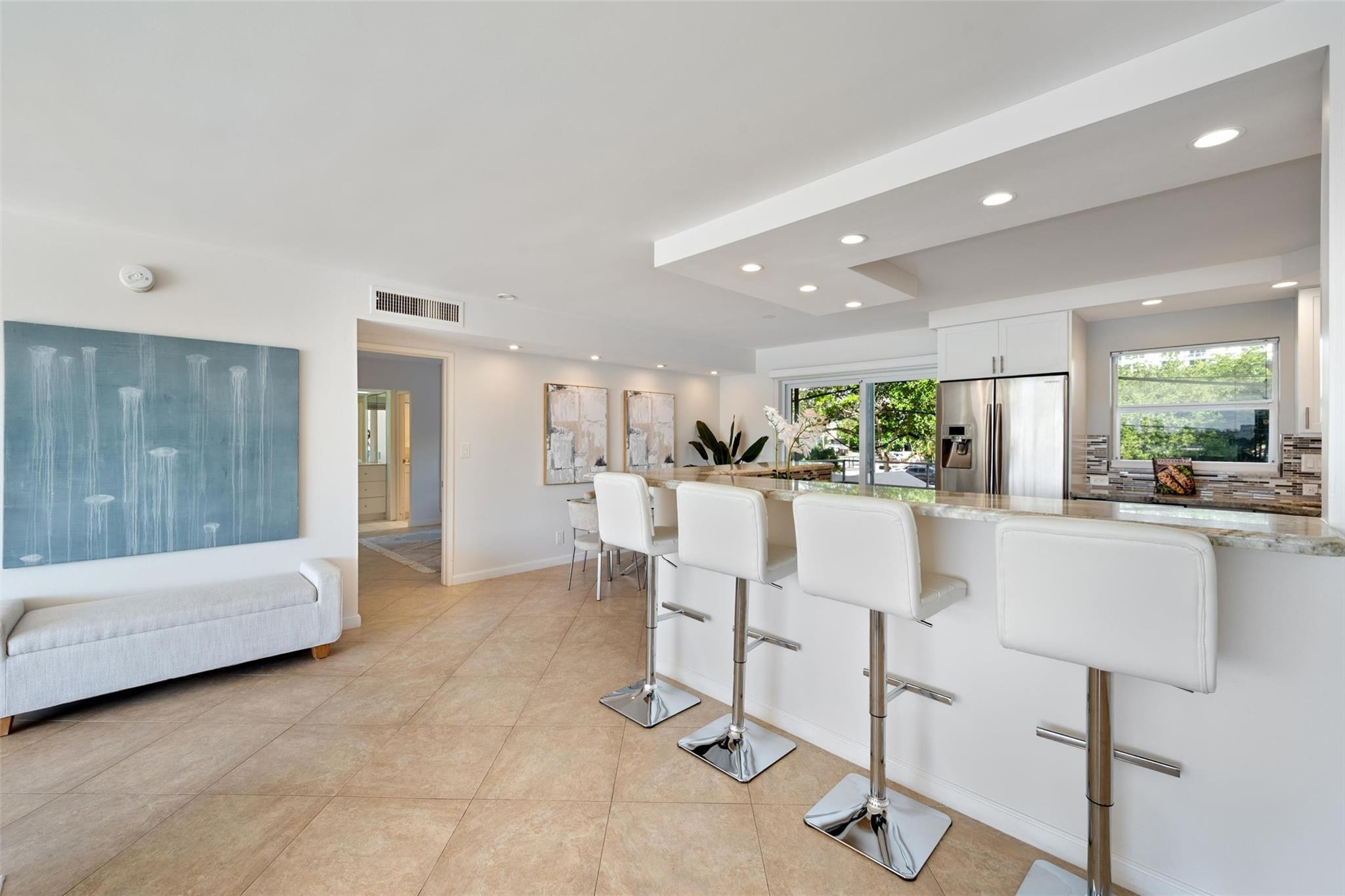 215 North Birch Road, Unit 2B Fort Lauderdale, FL 33304 - Photo 7 of 34 a view of kitchen with furniture and refrigerator