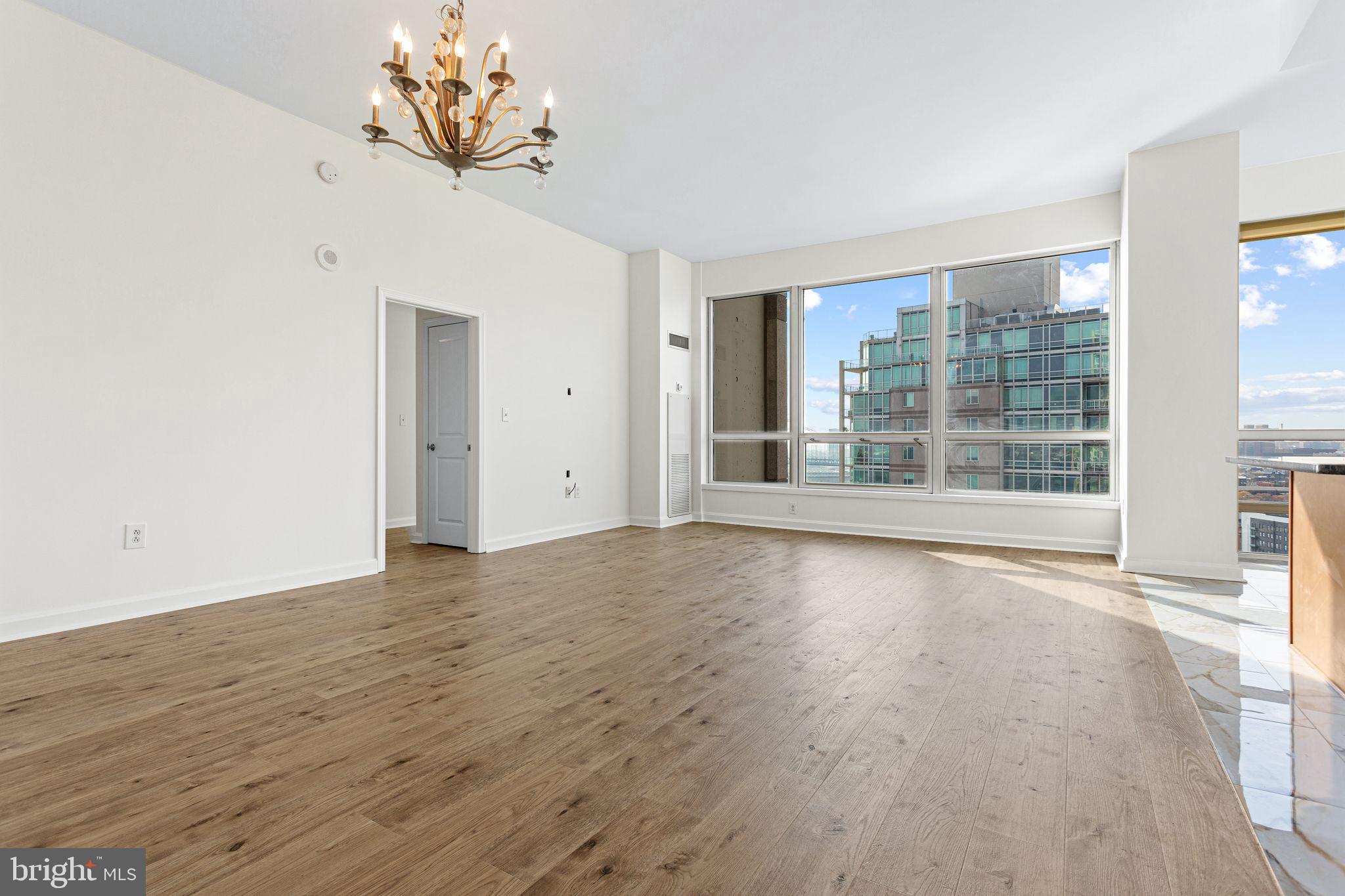 901 North Penn Street, Unit R2203 Philadelphia, PA 19123 - Photo 14 of 58 a view of an empty room with a window