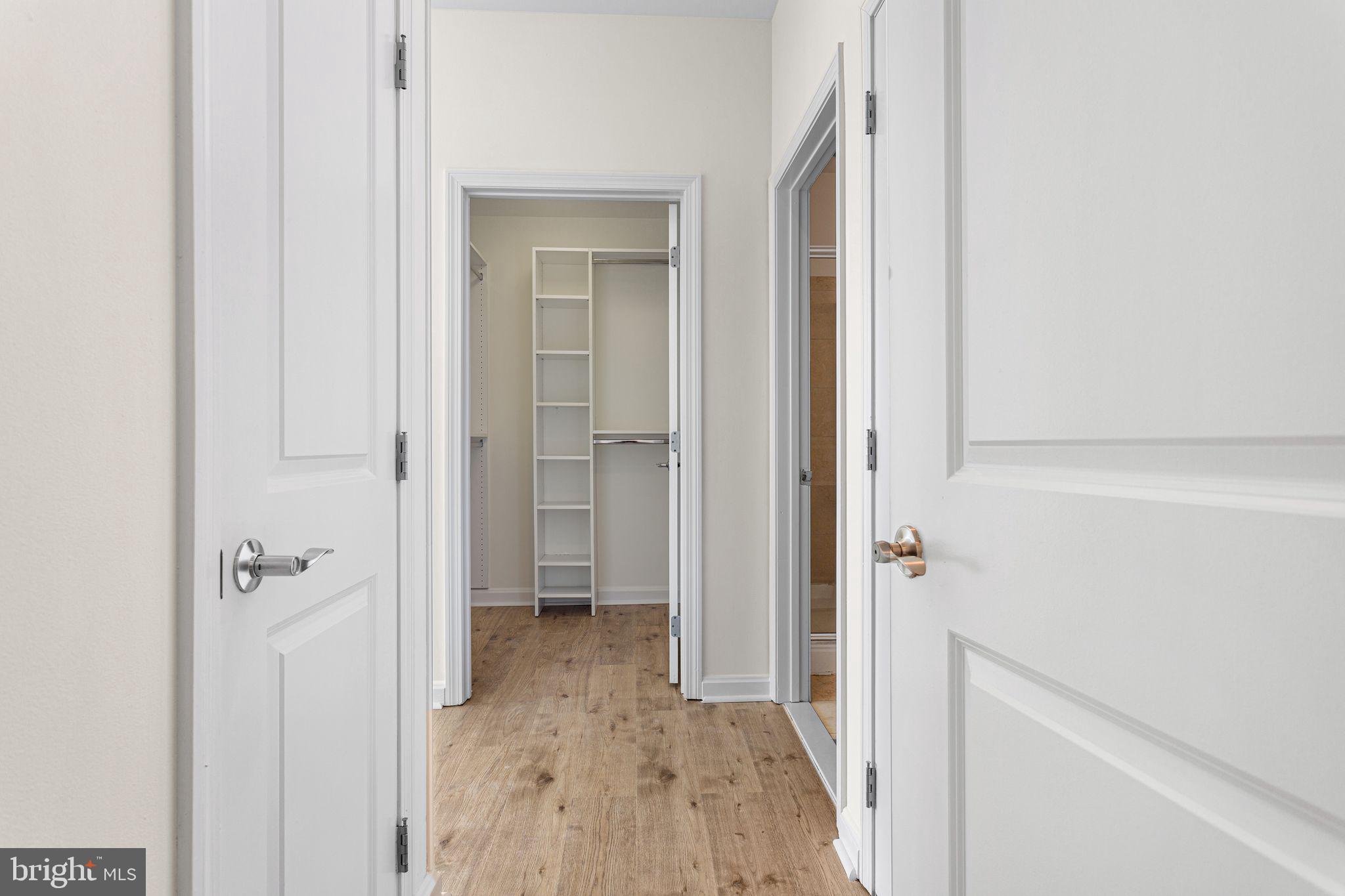 901 North Penn Street, Unit R2203 Philadelphia, PA 19123 - Photo 21 of 58 a view of a bathroom with a sink and mirror