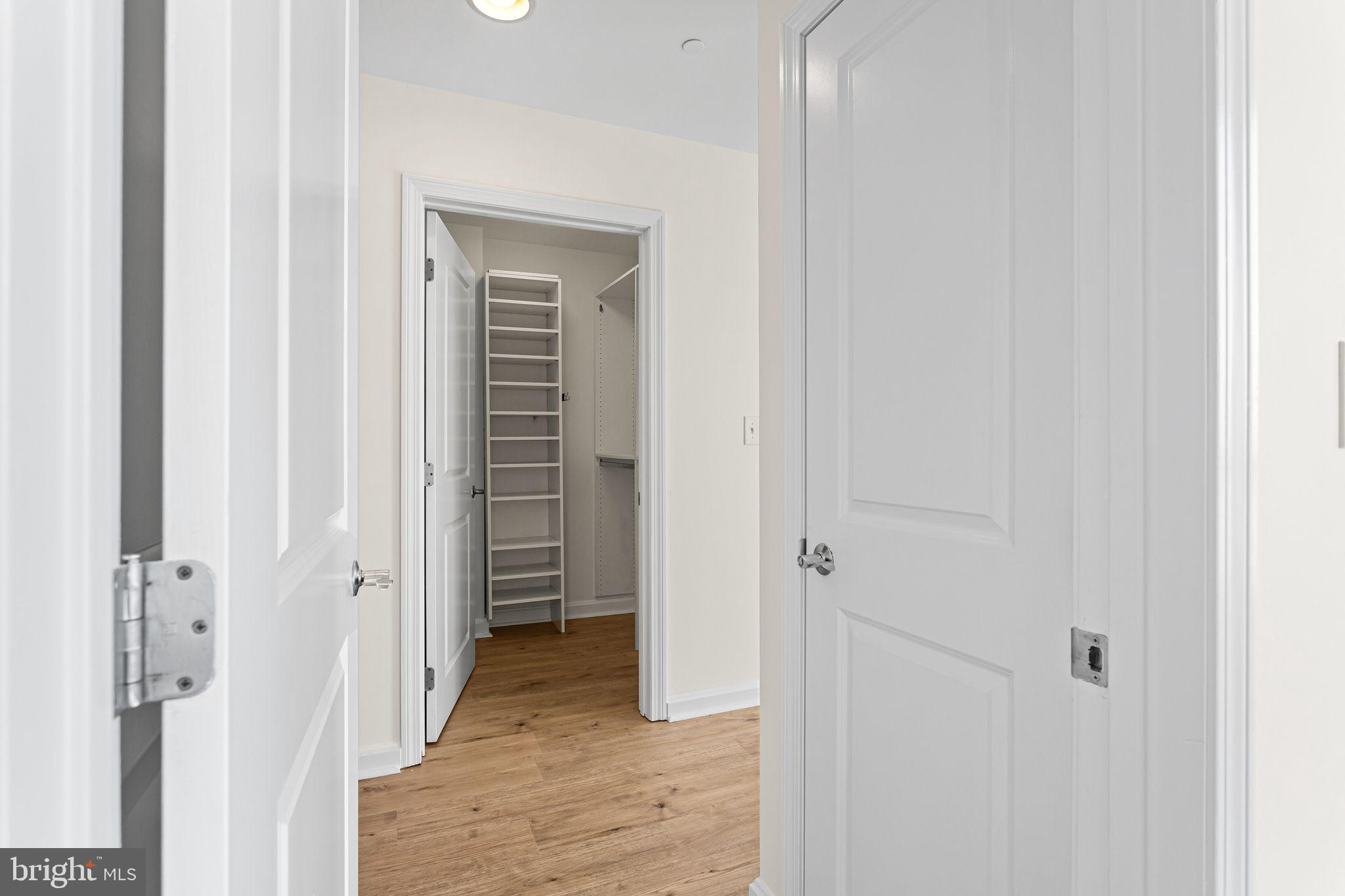 901 North Penn Street, Unit R2203 Philadelphia, PA 19123 - Photo 31 of 58 a view of a bathroom from a hallway