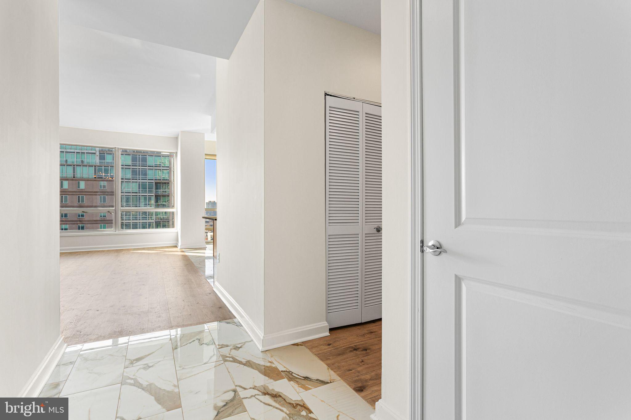 901 North Penn Street, Unit R2203 Philadelphia, PA 19123 - Photo 32 of 58 an empty room with windows