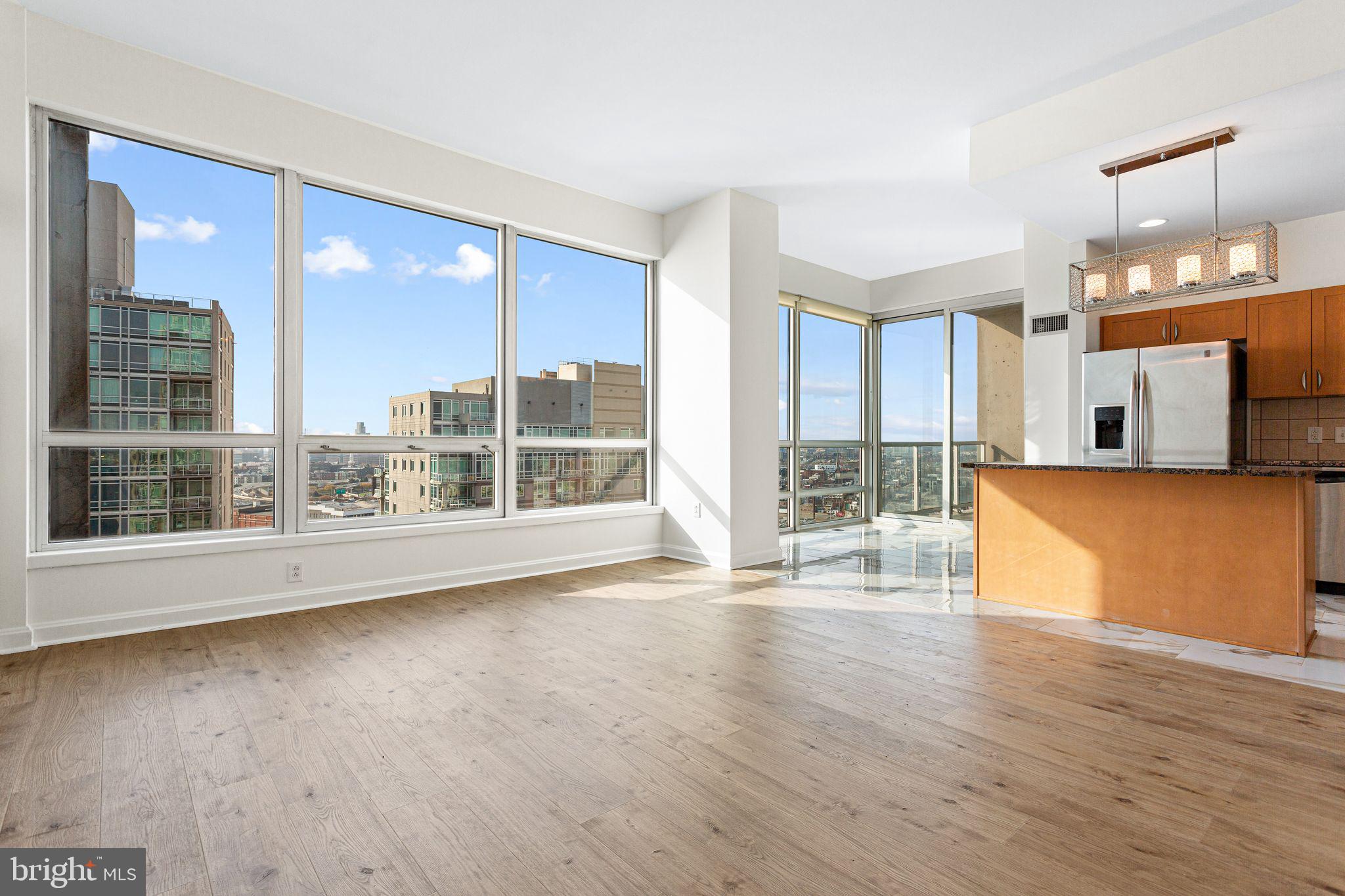 901 North Penn Street, Unit R2203 Philadelphia, PA 19123 - Photo 4 of 58 a view of a kitchen with wooden floor and a kitchen